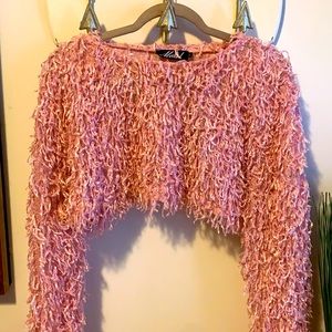 Shaggy, feather-like pink crop long sleeve top